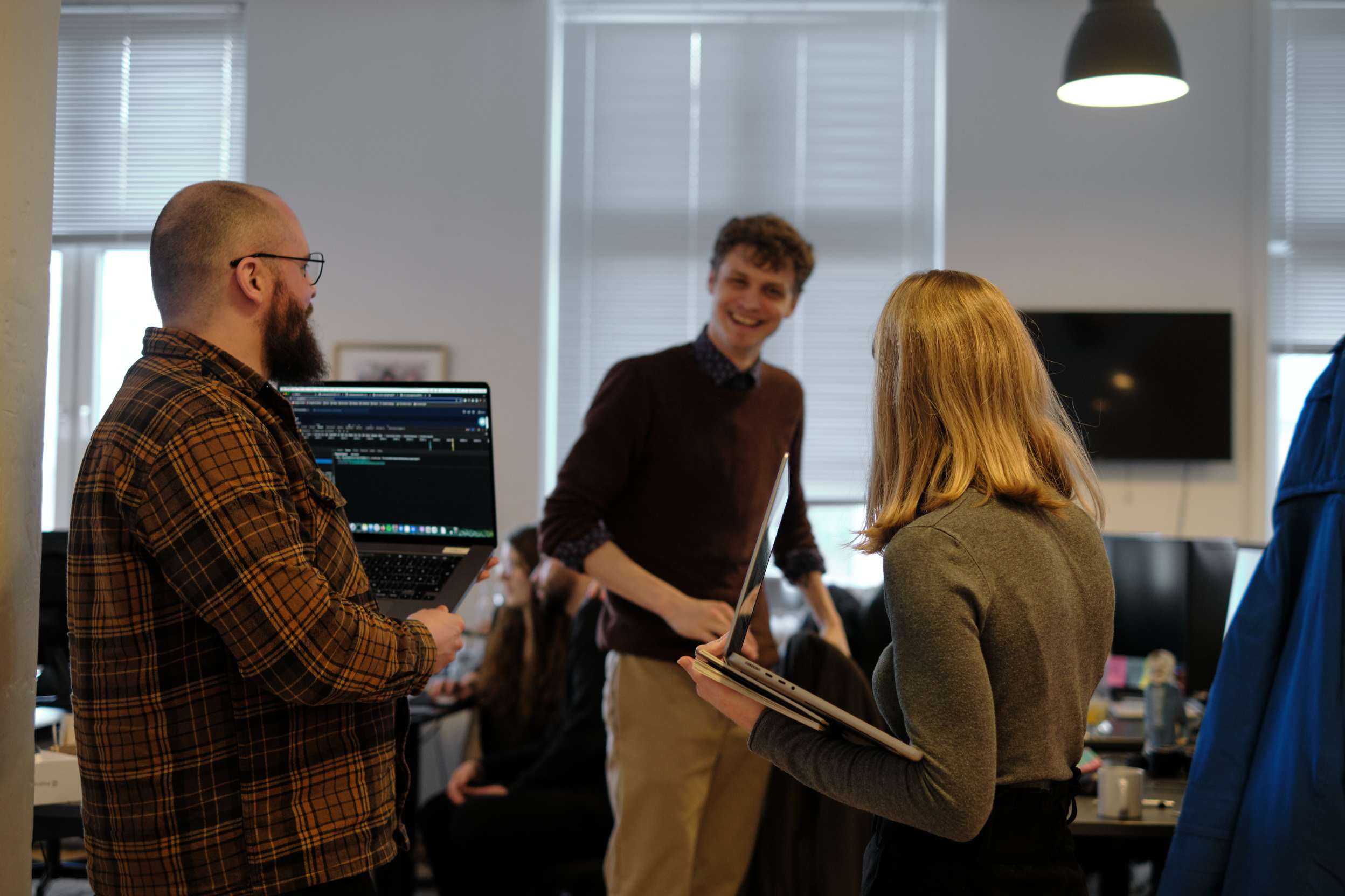 smiling employees at clerk.io