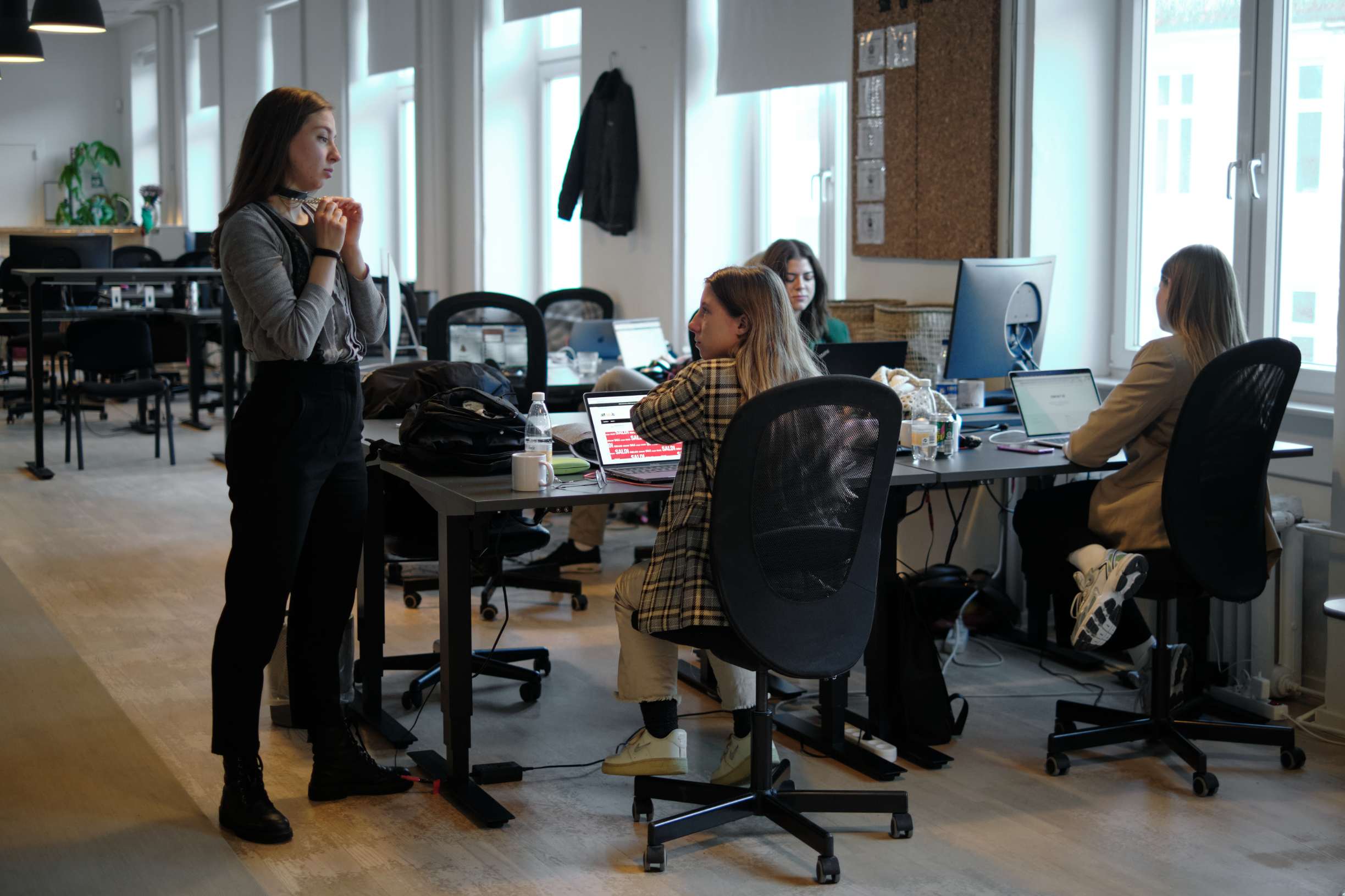 a team meeting at clerk.io offices with group of employees talking