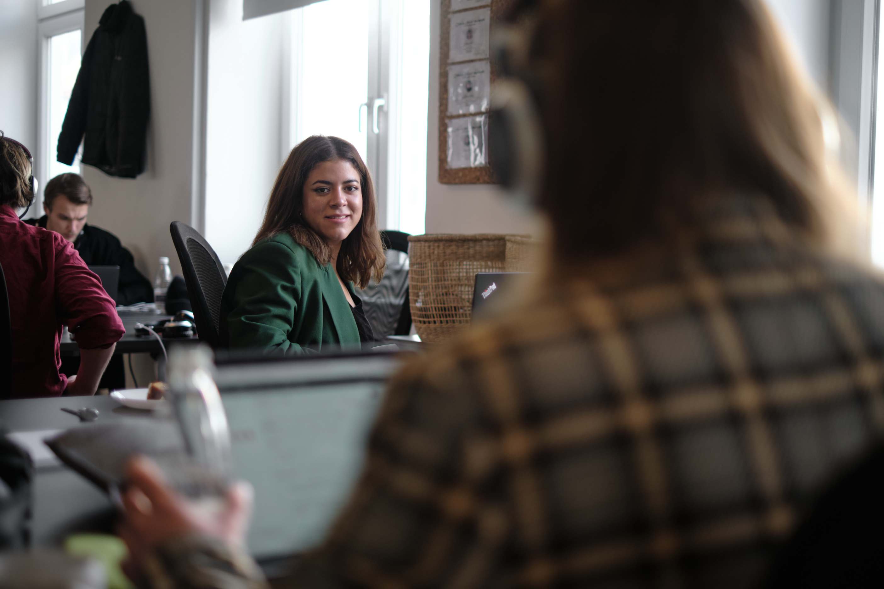 female worker at clerk.io talking to team member