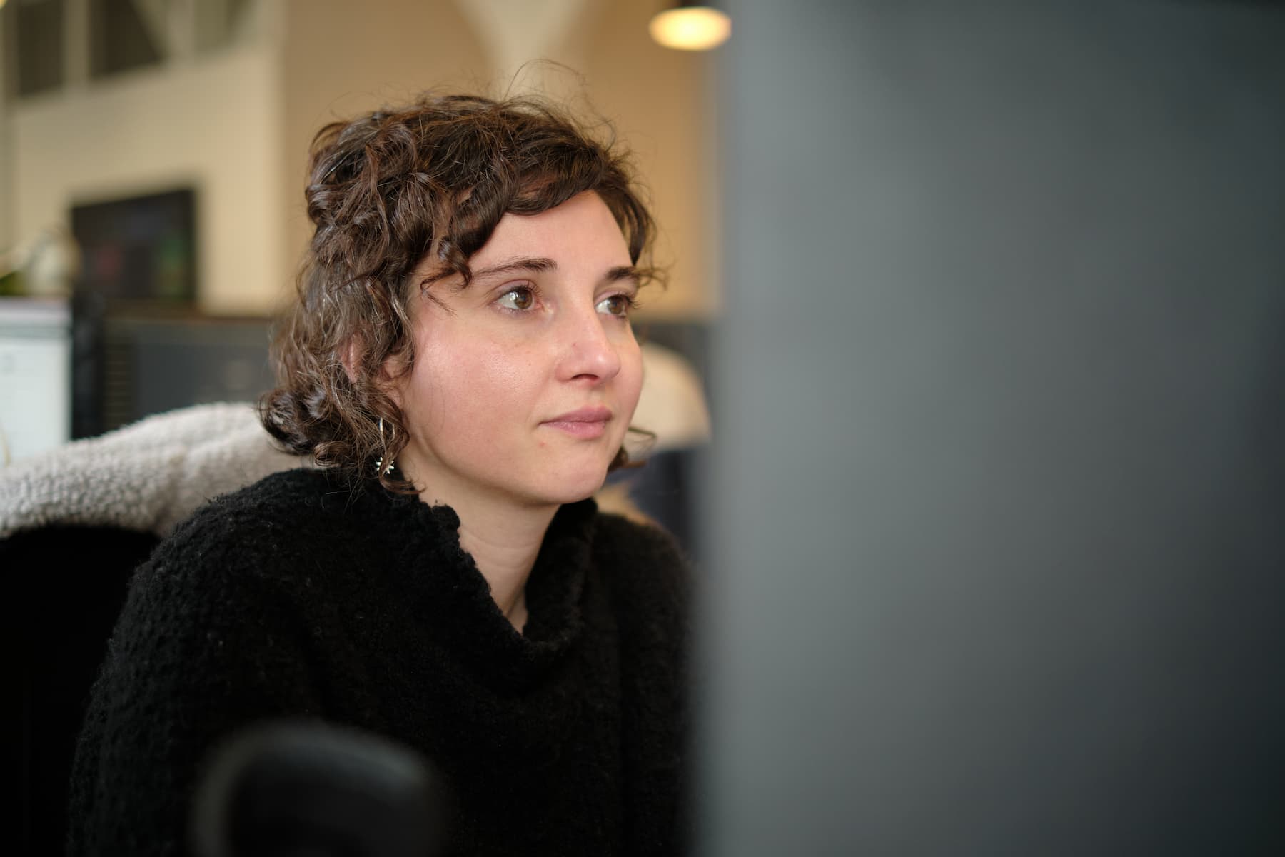female employee of clerk.io sitting at a desk working