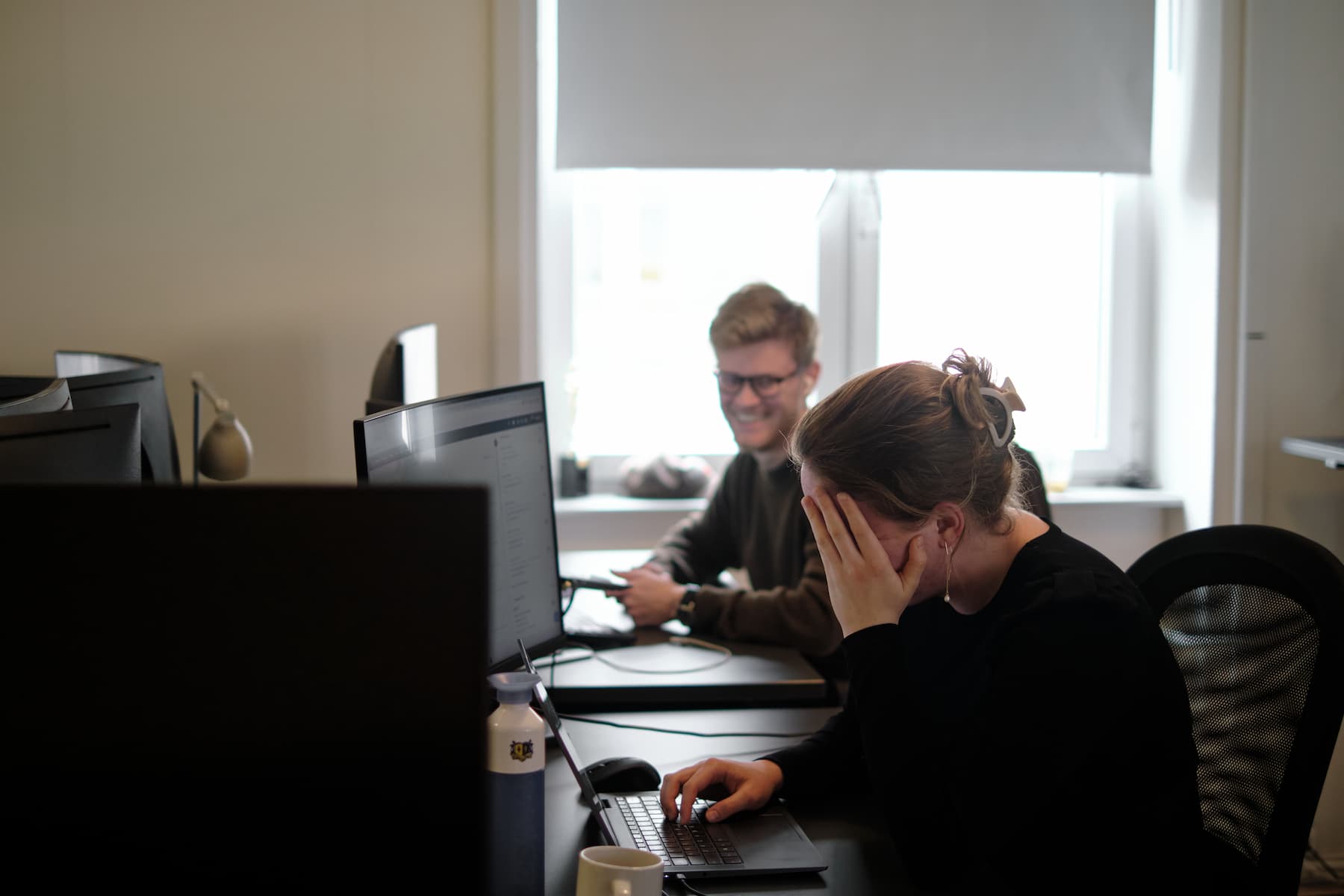smiling male and female coworkers