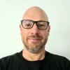 Photo of a man smiling at the camera
