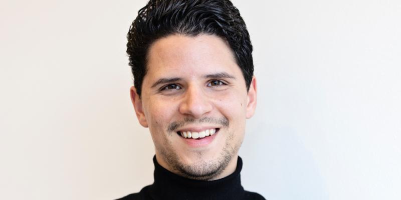 Photo of a man smiling at the camera